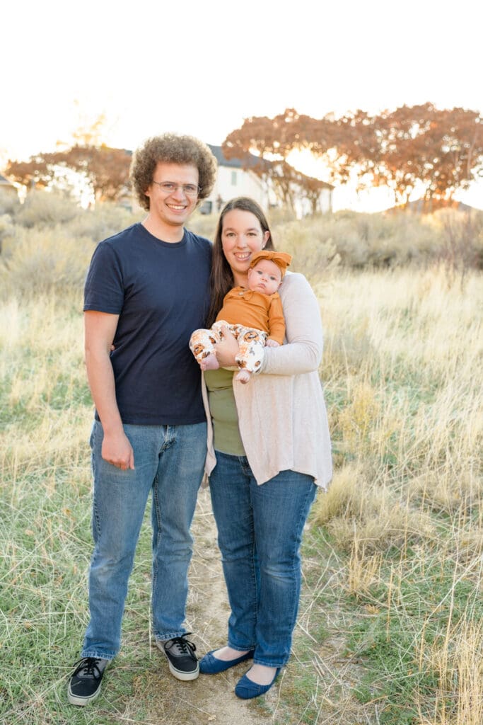 Family walks through fall trail