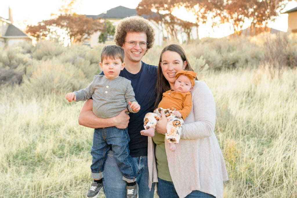 Family walks through fall trail