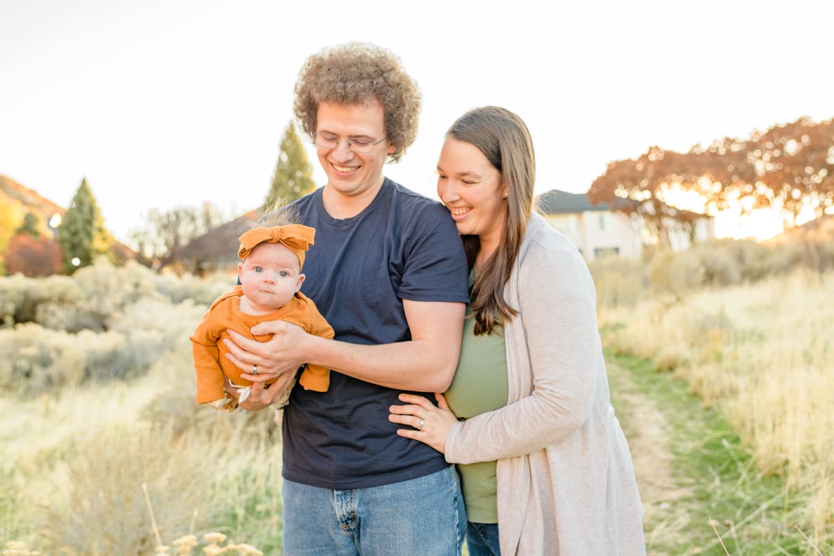 Family walks through fall trail