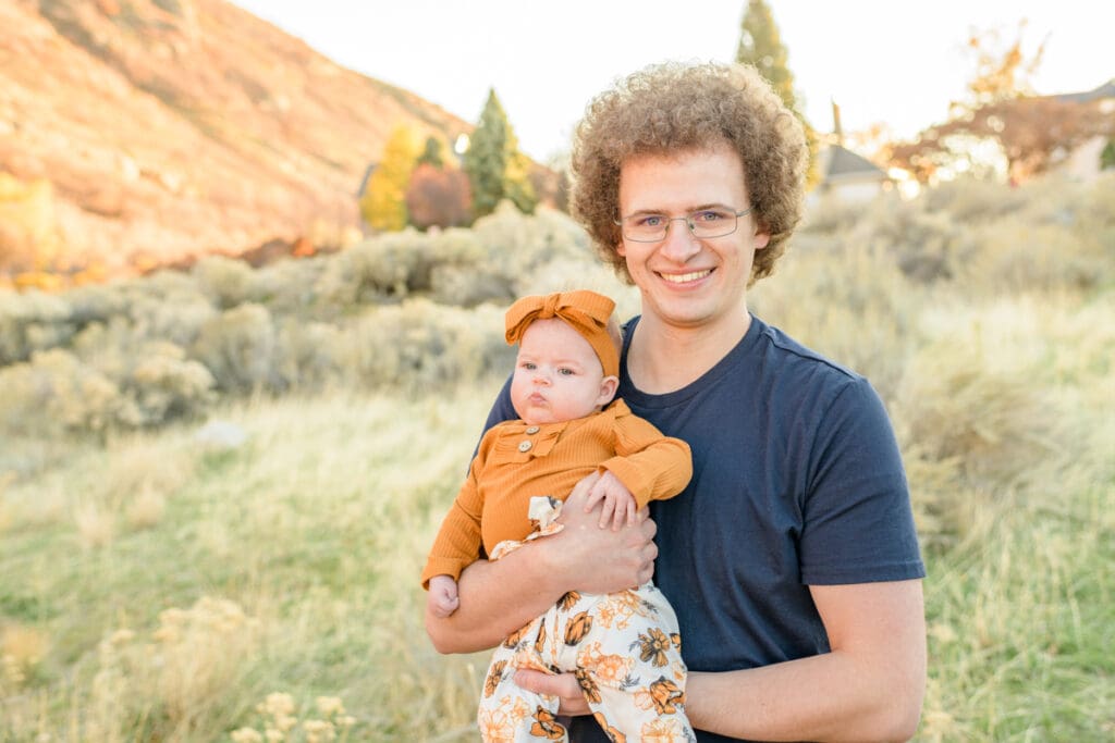 Dad holds his baby girl