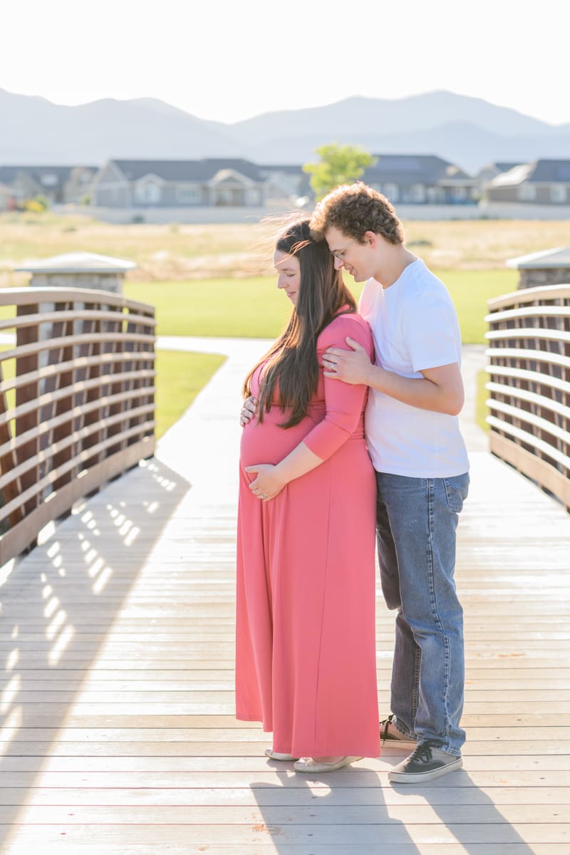Couple standing on a bridge