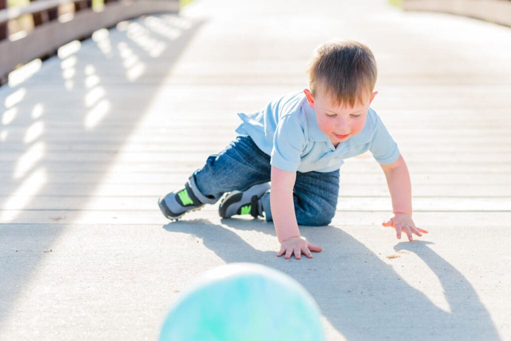 Toddler playing with a ball