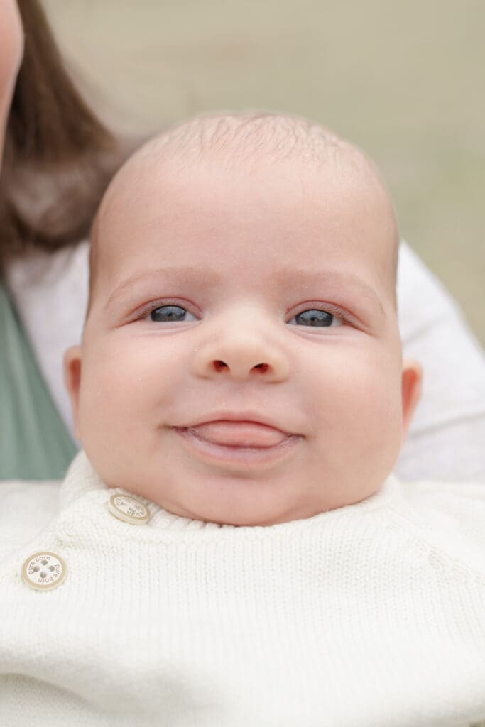 baby smiling in fall.