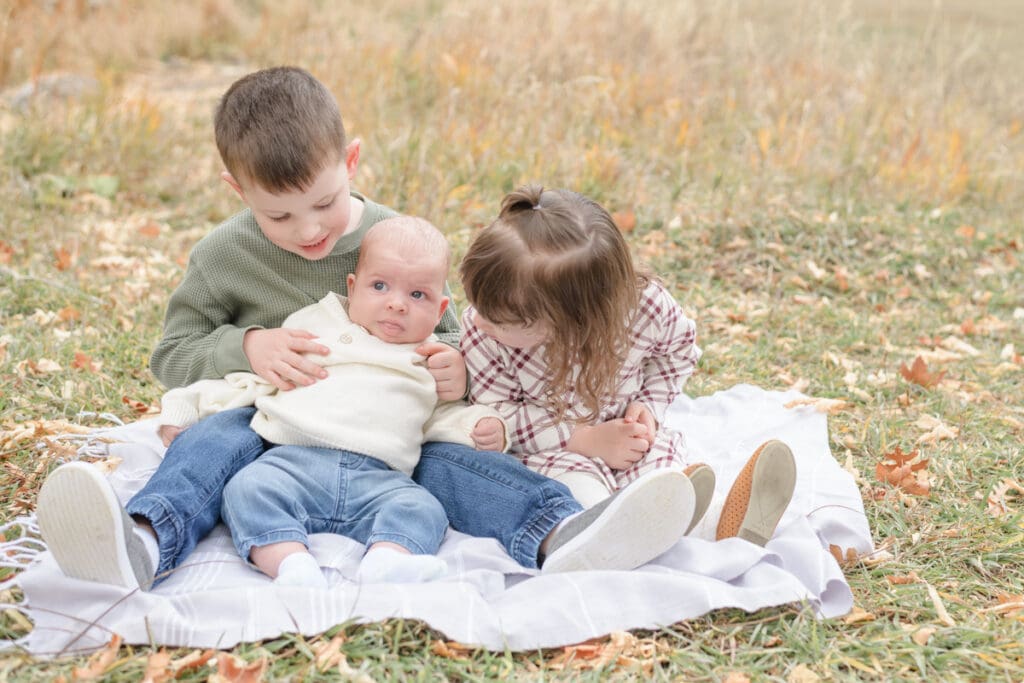 Small children hugging baby. Canyon Fall family Session