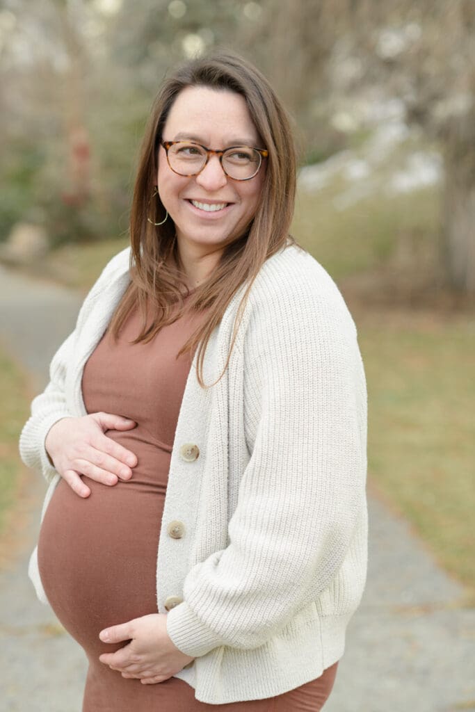 A pregnant mother smiles during her Murray Park maternity photo session.