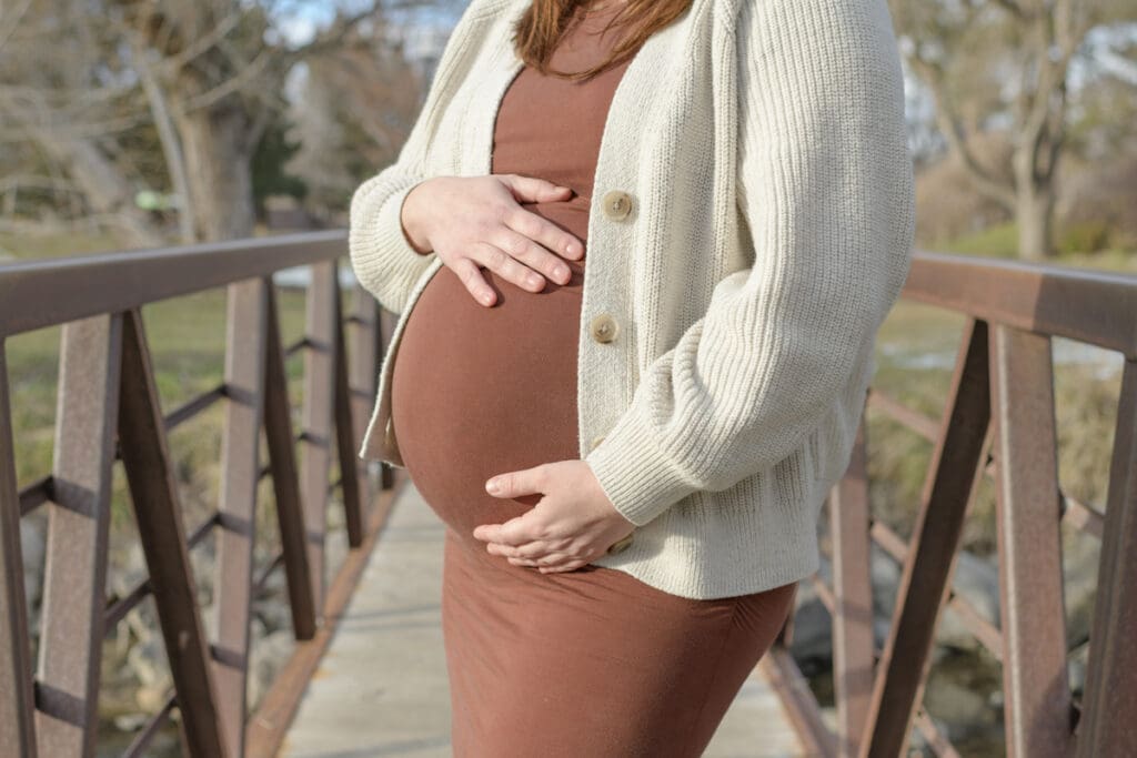 A close up of a  pregnant mama's belly during her Murray Park maternity session.
