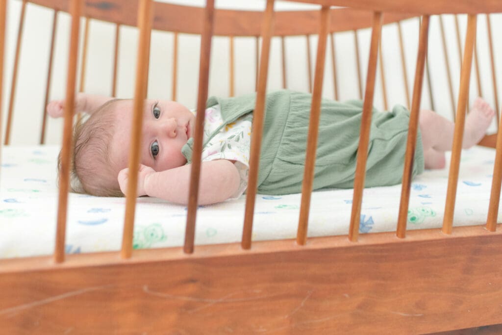 lifestyle newborn session with baby in a crib