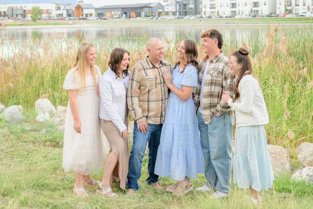 Daybreak Lake family session with family of six laughing together.