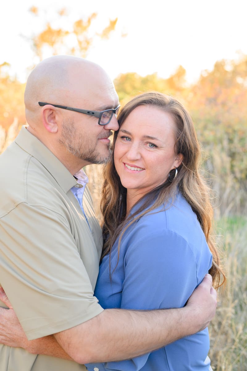Close up of a married couple smiling during a fall family session