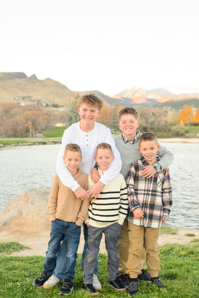 Five brothers smiling together during family storytelling photography