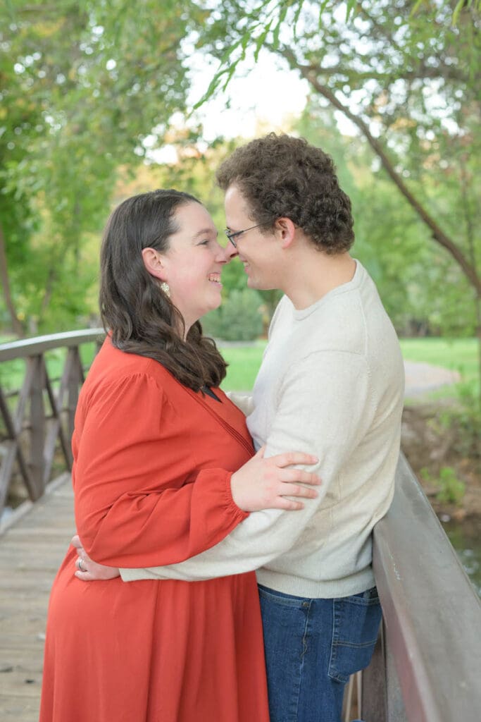 Husband and wife take a quiet moment together during fall family photos in Provo, Utah.